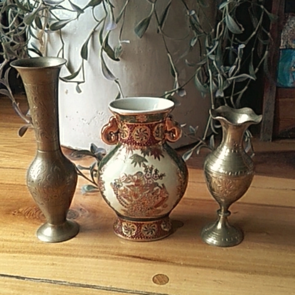 Brass and embossed porcelain vases.